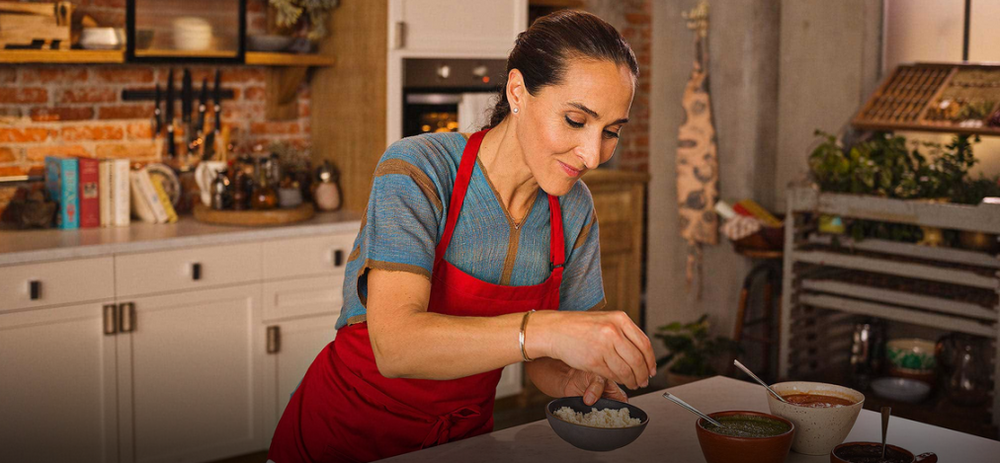 Latina chef preparing vegetarian meal for healthy living